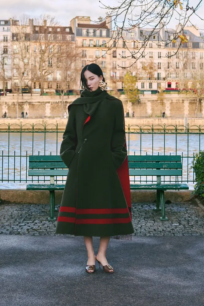 A model poses under Paris' famed Pont Neuf